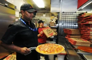 who owns angelo's pizza and restaurant in harvard illinois 2024